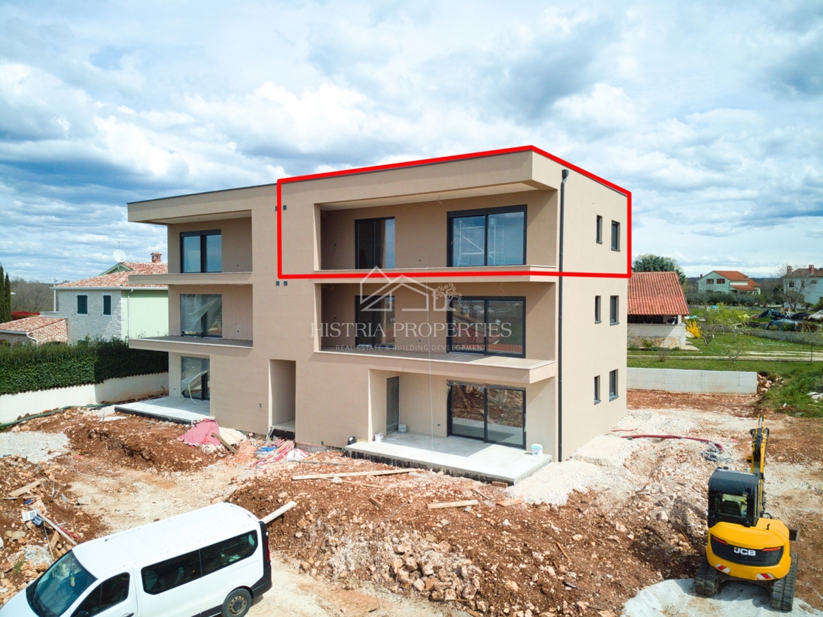 Quality new building with a view of the sea and a large terrace in a quiet location